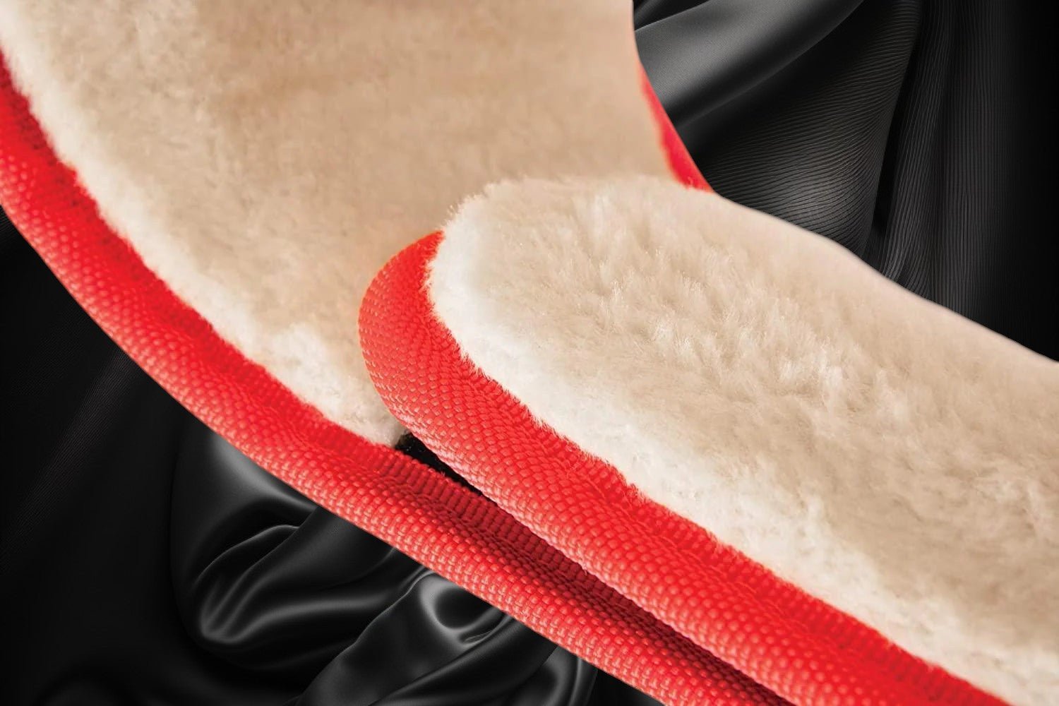 ottoman-belts-boxing-belt-lining Ottoman Belts boxing championship belt featuring soft beige faux fur lining and red trim on a black satin background.